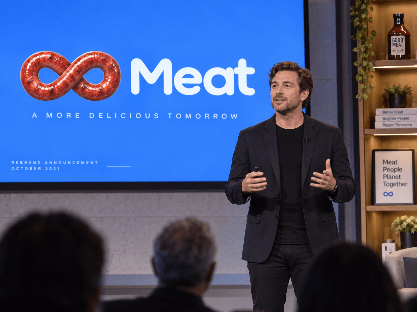 Rebrand announcement on stage with Meat logo on screen